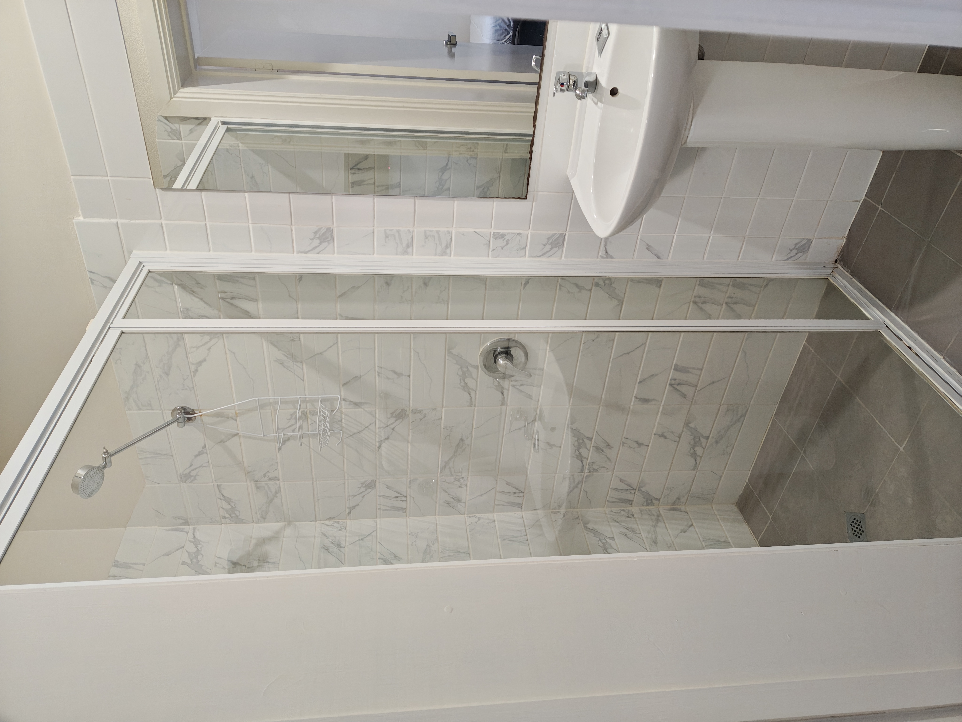 Private ensuite bathroom with shower and basin