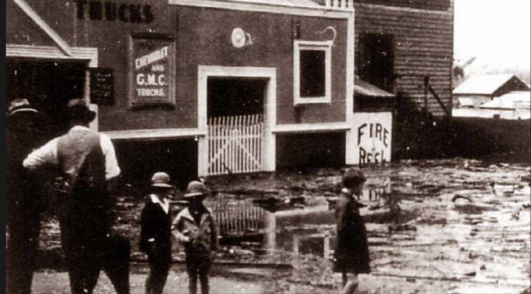 An early Gympie flood outside a period shopfront
